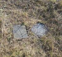 Plots - housing in Nové Zámky with manhole covers on the grassy area.