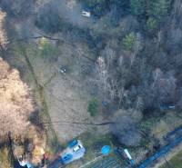 Aerial view of Recreational plots in Župkov, with surrounding trees and cars.
