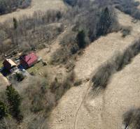 Aerial view of cottages surrounded by forest landscape at the Recreational Grounds of Kľak.