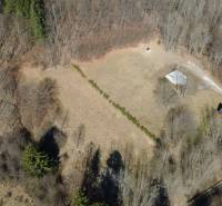 Aerial view of recreational plots in Kľak surrounded by forest and meadows.