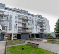 Apartment complex on Hrachova Street in Bratislava - Ružinov with outdoor space and trees.