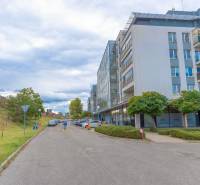 Hrachová Street in Bratislava - Ružinov with modern architecture and parking in front of the building.