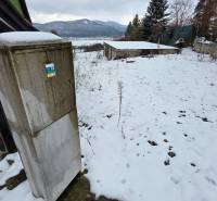 Snowy exterior at the Recreation Grounds in Považská Bystrica with a view of the snow-covered hills.