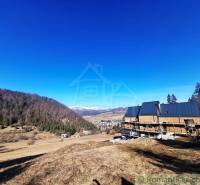 Construction of a house on agricultural and forest land in Hronec with a mountain panorama.