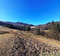 Scenery of agricultural and forest lands in Hronec with vast meadows and forests.
