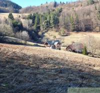 Cottages surrounded by forests on agricultural and forest land near Hronec.