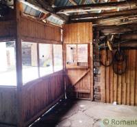 Interior of a family house with wooden decor and windows without curtains.
