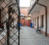 Courtyard with interlocking paving on Pekárska Street in Trnava, suitable for studio apartments.