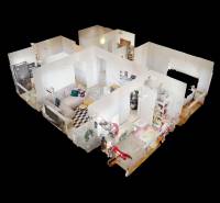 3D floor plan of a 3-room apartment with wood-patterned flooring and furnishings.