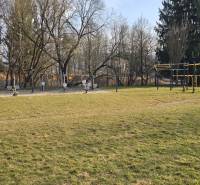 The exterior at Prachatická Street in Zvolen with exercise machines on an outdoor playground.