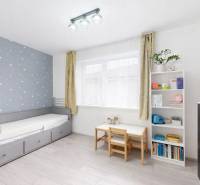 Children's room with a blue wall and stars, wooden decor flooring, furniture for a 3-room apartment.
