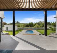 View from the family house in Dolný Kalník to the garden with a pool and lawn.