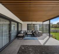 The terrace of a family house in Dolný Kalník with comfortable seating and a view of the garden.