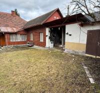 A family house in Babiná with a pitched roof, garden, and an annex.