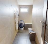 The bathroom in a 3-room apartment includes a washing machine, a bathtub, and a radiator.