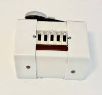 Living in a one-room apartment with a white plastic cover and switches.