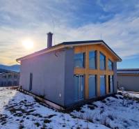 The cottage in Dolná Lehota offers a snowy view of the mountainous landscape and forests.
