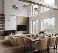 Interior of a cabin with a dining table, fireplace, and wooden decor flooring, illuminated by chandeliers.