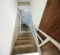 Staircase with a wooden decor floor in commercial premises.