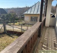 In Lipovci, a family house with a wooden balcony and a view of the garden and the road.