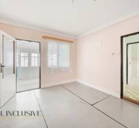 Interior of a family house with white walls and glass doors without wooden decor.