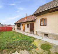 A family house in Topoľníky with a courtyard, garden, and traditional facade.