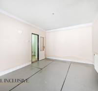 Bright room with white walls and doors in a family house.