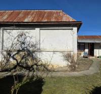 A family house in Pavlovce nad Uhom with a yard, roof with rusting sheets.