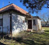 A family house in Pavlovce nad Uhom with a metal roof and a garden.