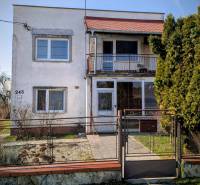 A family house on Nová Street in Lastovce with a small front garden and a balcony.
