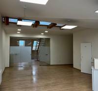 Offices with wood-patterned flooring, glass doors, and stairs.