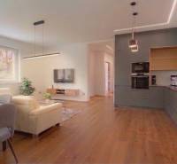 Living room in a family house with a sofa and a wooden decor floor.