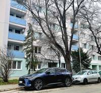 Pod Párovcami Street in Piešťany with an apartment building and parked cars in front of a 2-room apartment.