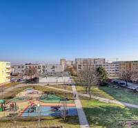 A playground surrounded by apartment buildings on Veterná Street in Trnava offers a view of a 4-room apartment.
