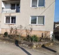 A family house in Mankovce, two-story with a balcony and an adjacent garden plot.