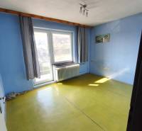 Blue walls, yellow floor, large window, radiator, curtains, lamp. Family house.