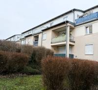Exterior of a 3-bedroom house in Kittsee with a garden and balconies.