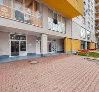 The exterior of the building on Antolska Street in Bratislava - Petržalka with commercial spaces.