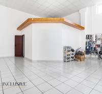 Commercial premises with white walls and ceramic flooring. Includes stored goods.