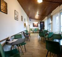 A café with a wooden ceiling and decorative chairs, Gastro spaces.