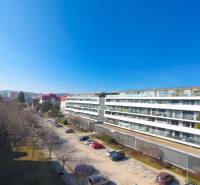 Apartment complex on Pri vinohradoch street in Bratislava - Rača, view of the park and parking lot.