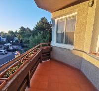 The balcony of a 4-room apartment on Priekopnícka Street in Bratislava - Podunajské Biskupice with flower pots.