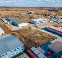 Aerial view of commercial land in Bratislava - Vajnory with buildings and open space.