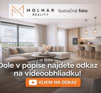 Living room in a 3-room apartment with a wood-patterned floor and a large window.