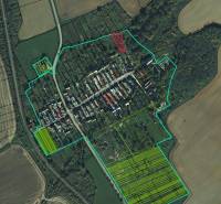 Aerial view of recreational lands in the village of Gemerské Teplice, surrounding fields and forests.