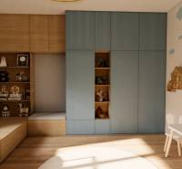 Children's room in a 3-room apartment with drawings on the wall and a floor with a wooden decor.