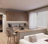 A kitchen in a studio apartment with a wood-patterned floor and light-colored seating.