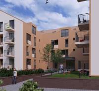 The exterior of a building with multi-storey apartments in the city of Poprad and people on the balconies.