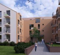 Residential building with trees and balconies in Poprad, suitable for a 1-room apartment.