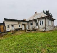 A family house on Seredska Street in Hlohovec with an older roof, garden, and plaster.